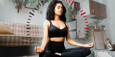 Woman meditating in her living room for 15 minutes a day