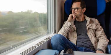 Man eavesdropping on a train
