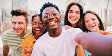 happy group of friends taking a selfie