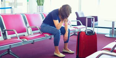 woman angry after being denied boarding her airplane flight