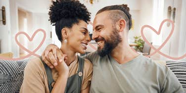 couple looking in to each others eyes with hearts