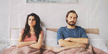 Couple sitting up in bed not touching, sexless marriage 