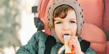 Child eating a healthy snack 