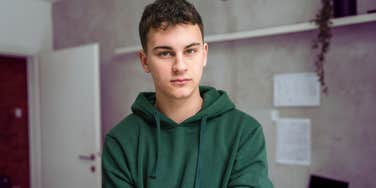 Teen in dorm room looking like teenagers today 