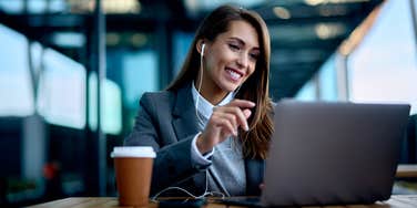 Woman working in airport during a business trip.