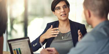 Woman using vocal cues while speaking to her manager.