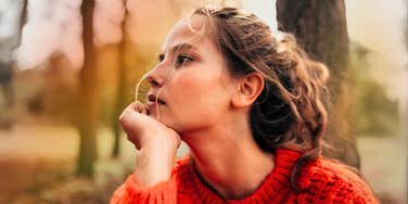 Pensive woman getting through the first days of a major crisis.