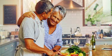 Woman and man cook together and man is falling for her because of her green flags.