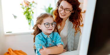 Mother and Neurodivergent daughter doing homework together, back to school