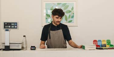 Cashier standing at counter