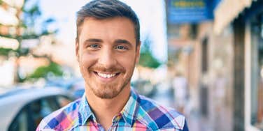 smiling man trying to earn respect of others