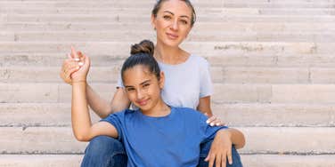 Mom sitting with daughter growing their goal of attachment