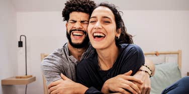 Couple in love smiling and embracing each other