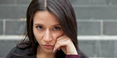 young brunette woman looking serious