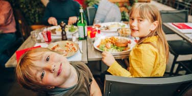 Kids at meal with expensive bill