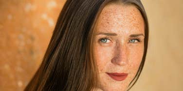 unhappy woman with freckles