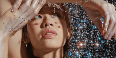 woman looking into universe for message october 1, 2024