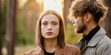 Redhead woman trying to break free from guy who treated her bad