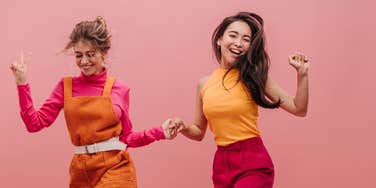 Two women dancing to help reduce their depression 