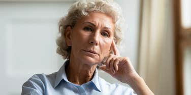 older concerned woman thinking