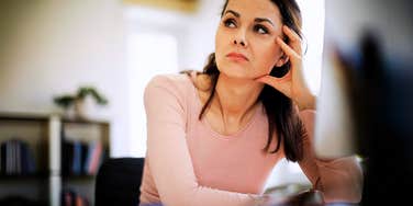 Woman recongizing signs she may be being quiet fired from job. 