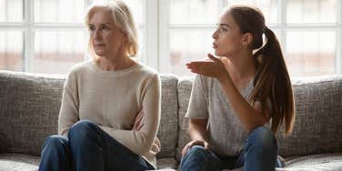 adult woman yelling at older mother