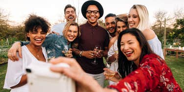 Woman with high self esteem together with her group of friends