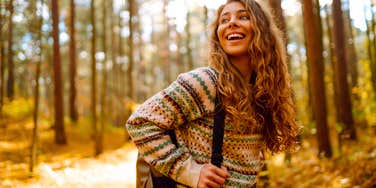 woman taking a walk in the woods