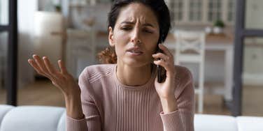 upset woman talking on the phone