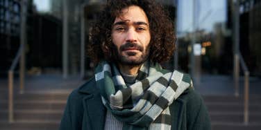 serious young Caucasian businessman looking at camera 