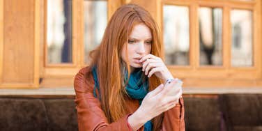 Woman looking at online content on her phone