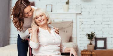 Woman caring for her elderly boomer mom