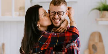 Woman being overly lovey towards boyfriend. 