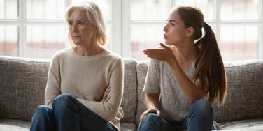 adult woman yelling at older mother