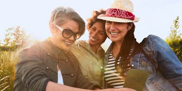 Three women in their 40s and 50s making joyful decisions about life