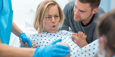 Daughter-in-law in delivery room giving birth