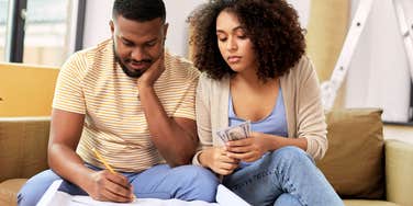 Couple looking at their finances together. 