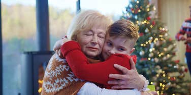 Estranged mom hugging grandkid