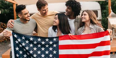 Friends holding the American flag