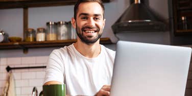 Happy man successfully making a LinkedIn post, and getting job offers