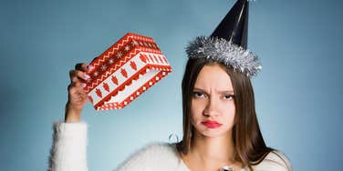 young woman upset about not receiving Christmas gifts