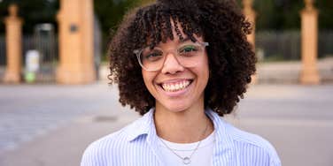 Confident woman smiling at the camera.