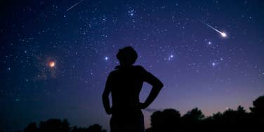 man staring at night sky