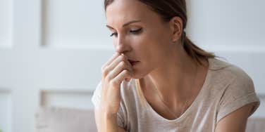 worried woman sitting and thinking