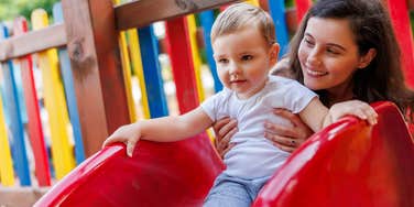 Nanny with her kid at the playground