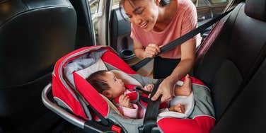 newborn heading home from the hospital in a car seat