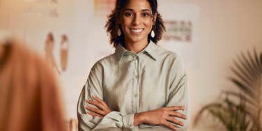 smiling woman standing in her office