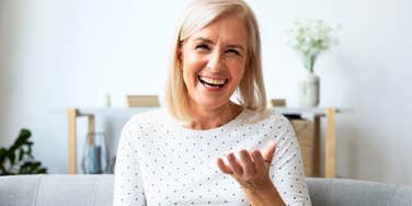 Woman speaking with her hands, engaged in conversation.