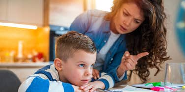 frustrated teacher trying to get student to focus