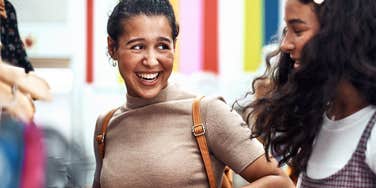 Young women siblings shopping together as best friends 